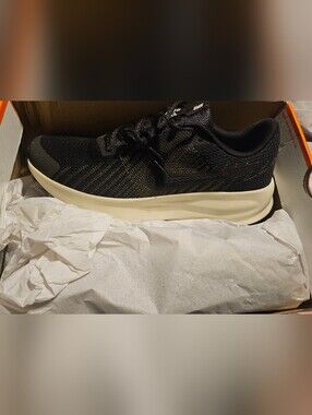 Nike Black Running Sneakers with Gold Accents and Cream Midsole